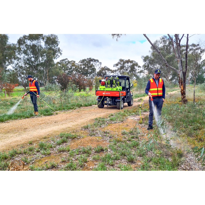 Two operators spraying along a track with the OnDeck twin SuperReel sprayer