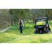 Operator spraying a fence line with the ReelStrike 200L hose reel from a UTV