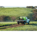 SuperReel 1000L Twin Reel Slip On Field Sprayer spraying on hillside