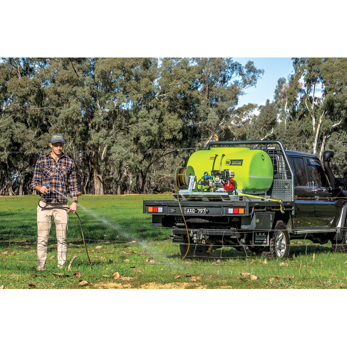 Hose spraying from a flatbed ute with the TopCrop 400L short sprayer