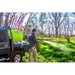 Hose spraying from a flatbed ute with a TopCrop slip on sprayer
