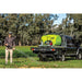 Hose spraying from a flatbed ute with a TopCrop slip on sprayer