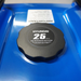A black Hyundai 25-liter minimum octane fuel cap on a bright blue plastic fuel tank.